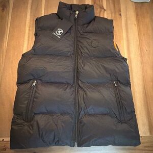 The item in the image is a puffer vest from the brand 7TH HVN (Seventh Heaven).